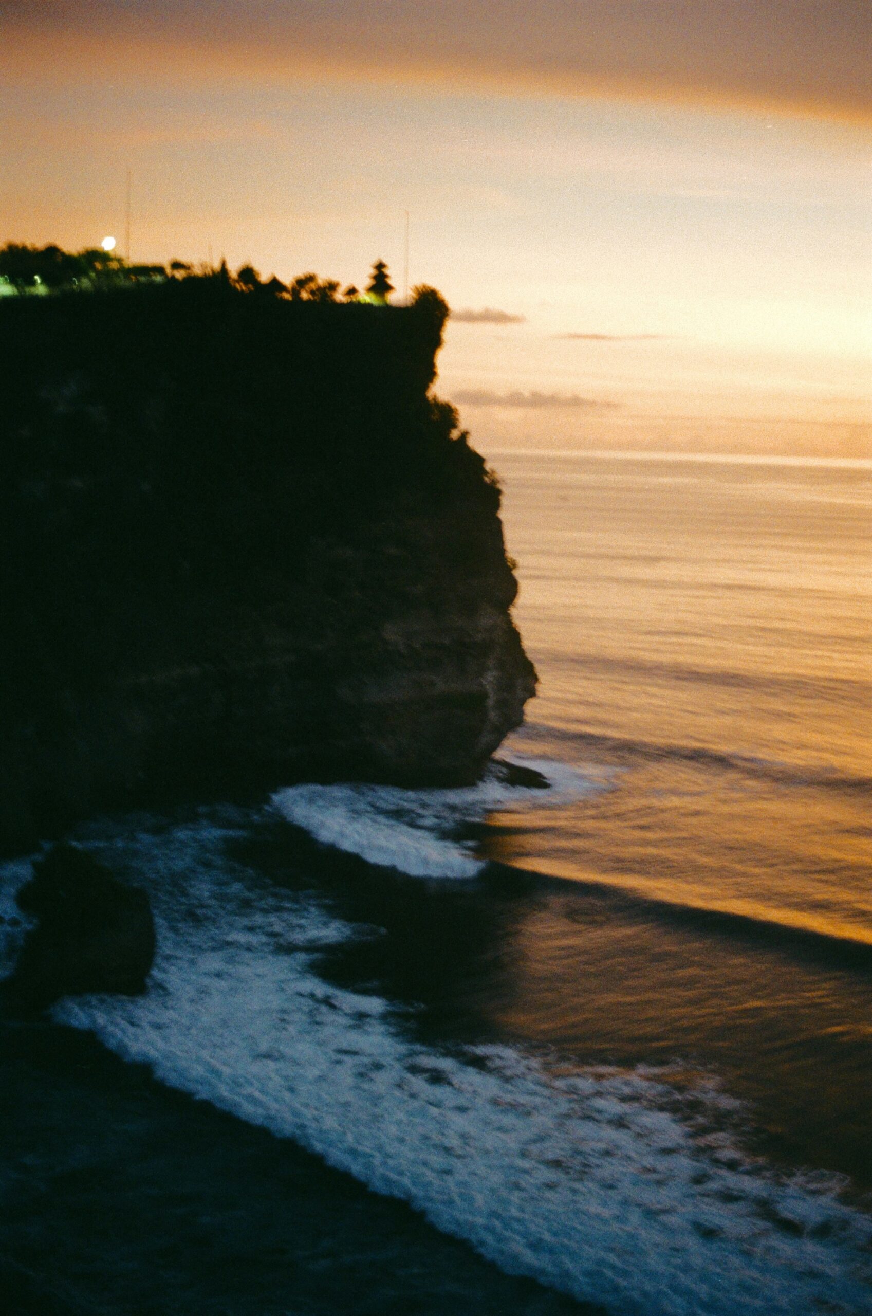 A clifftop sunset view over the ocean near Uluwatu Temple, Bali