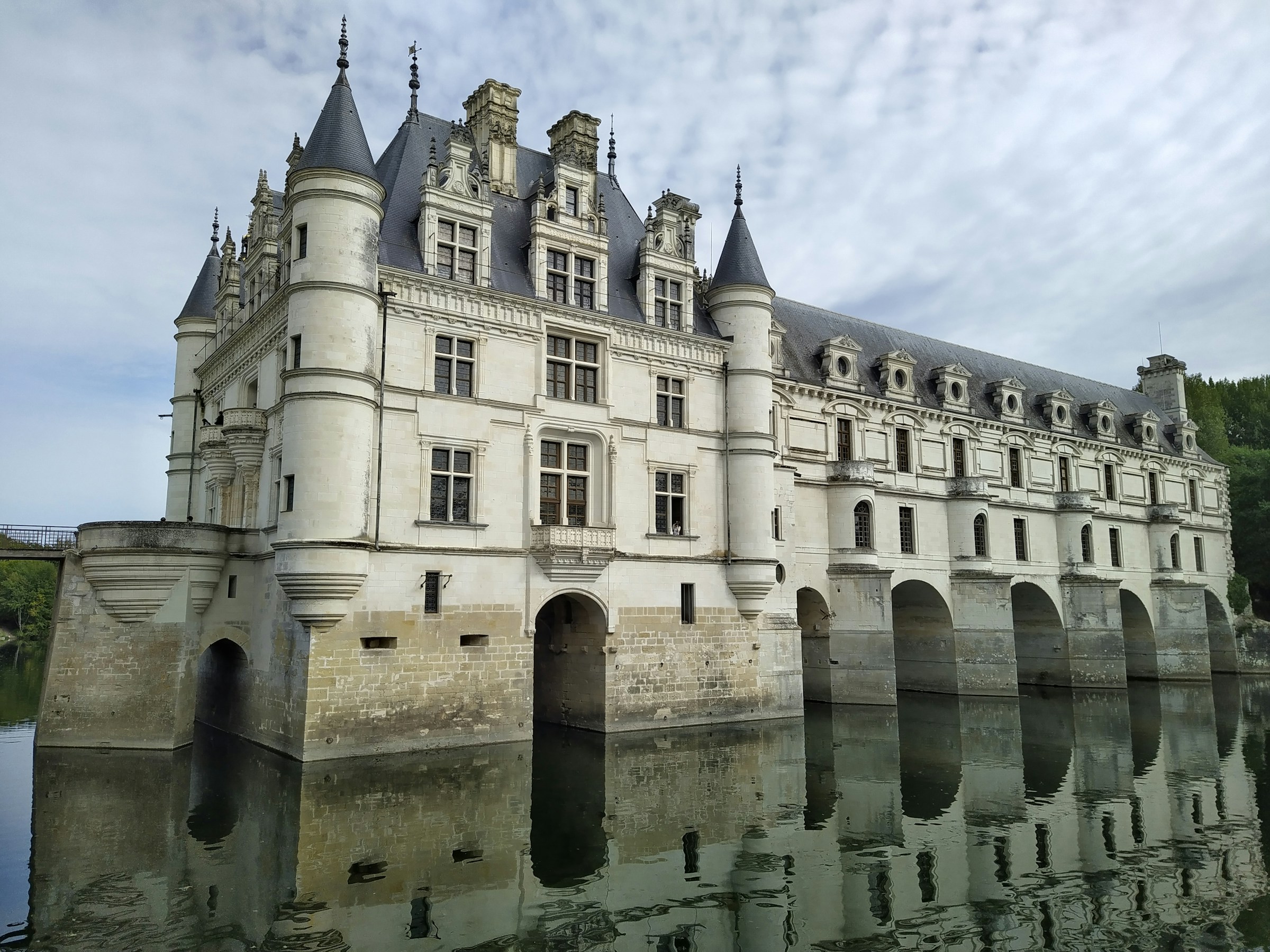The white stone Chateau de Chenonceau spanning the River Cher in France's Loire Valley