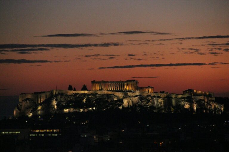 The ancient Acropolis of Athens glowing in warm sunset light