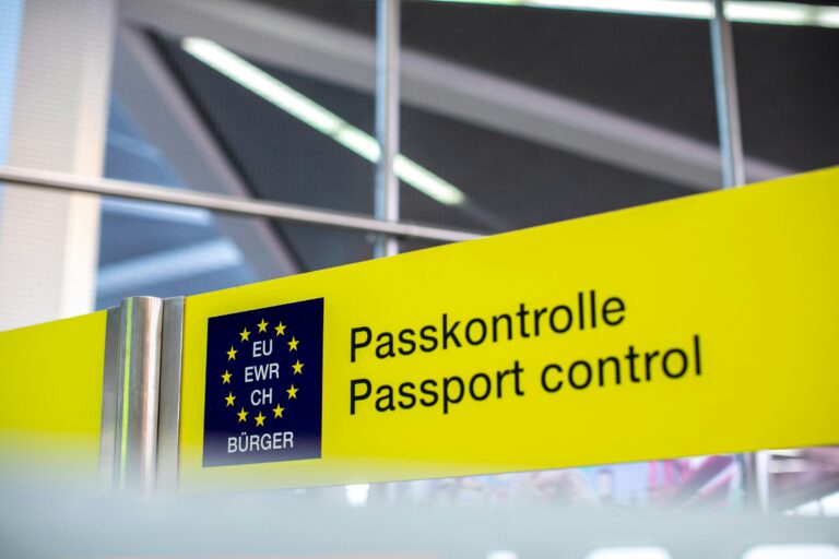 Yellow Passkontrolle passport control sign at a European border crossing