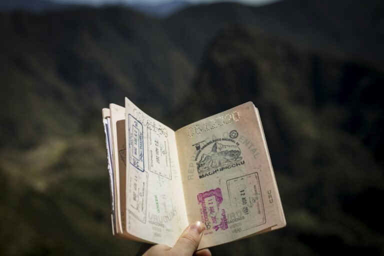 Close-up of a traveler holding an international passport before departure