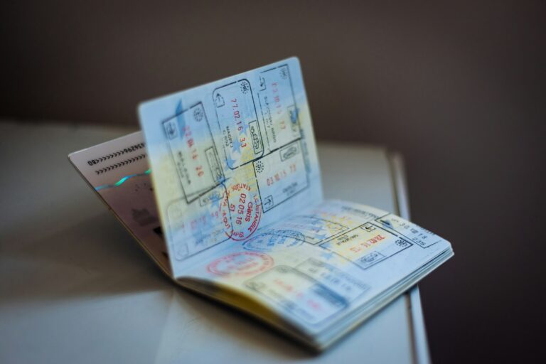 A passport and travel documents arranged on a table