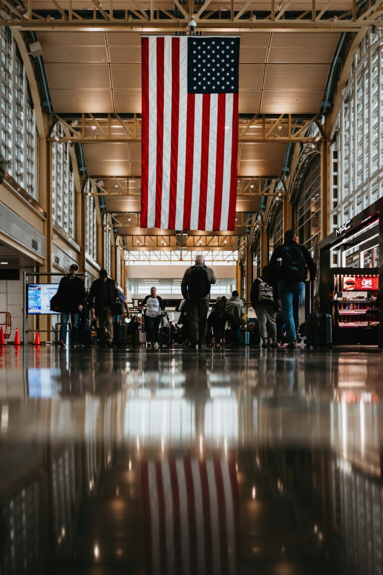 A large American flag hanging inside the terminal at Ronald Reagan Washington National Airport